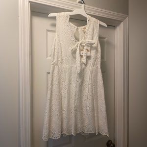 White boutique style dress with tie front. NWT, never worn.